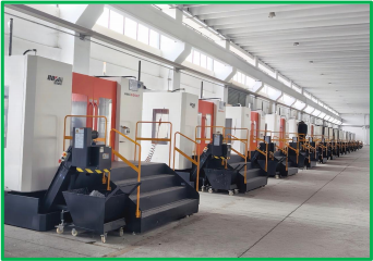 Row of CNC machining centers on a production floor